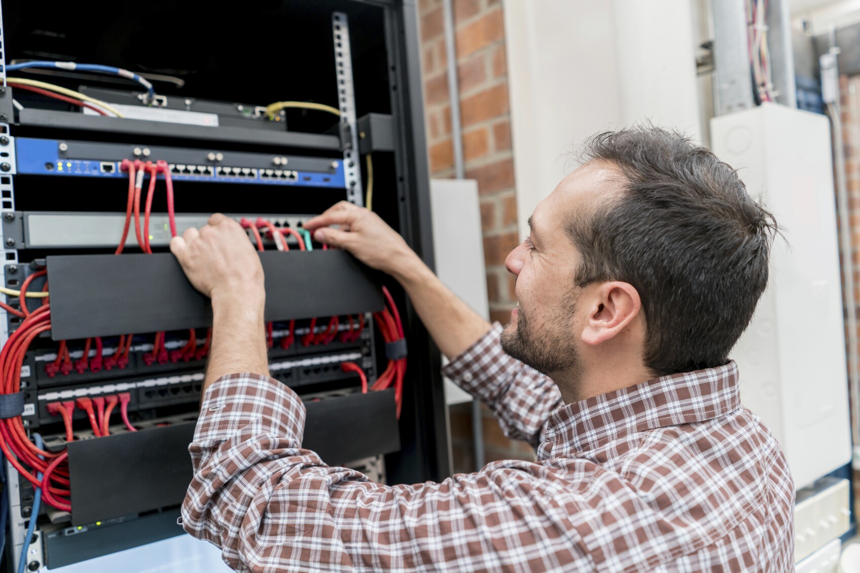 man working on electrical wiring
