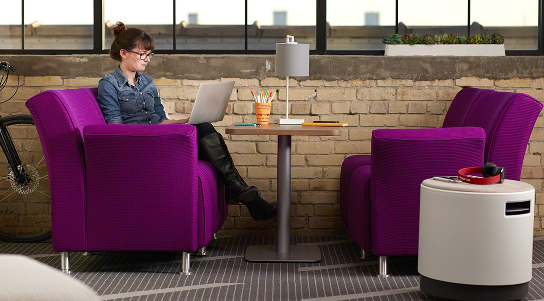 person working at lounge setting