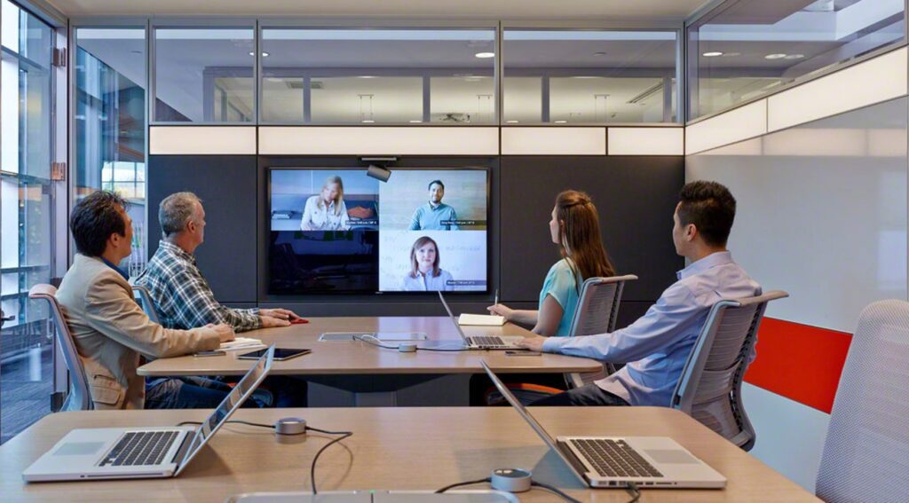 workers collaborating with hybrid technology