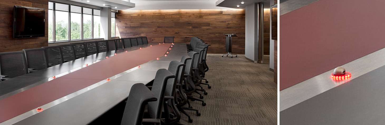 custom conference table with embedded microphones and LED lighting