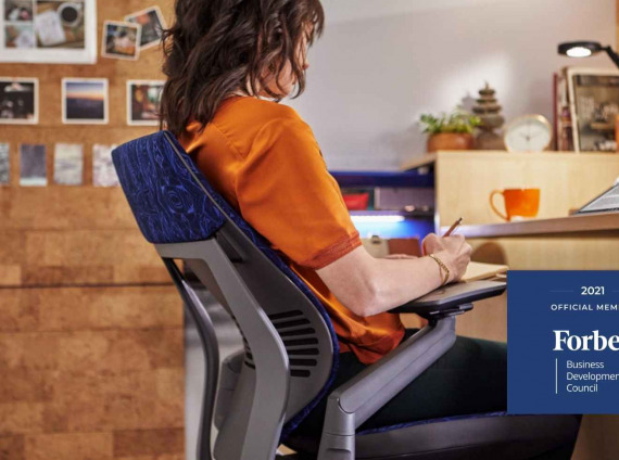 Woman sitting in Steelcase chair working remotely